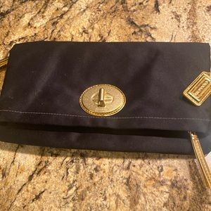 Coach black folding purse with chain.